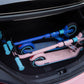 Two ninebot zing e8 in the trunk of a car. Folded and portable. One blue and one pink.