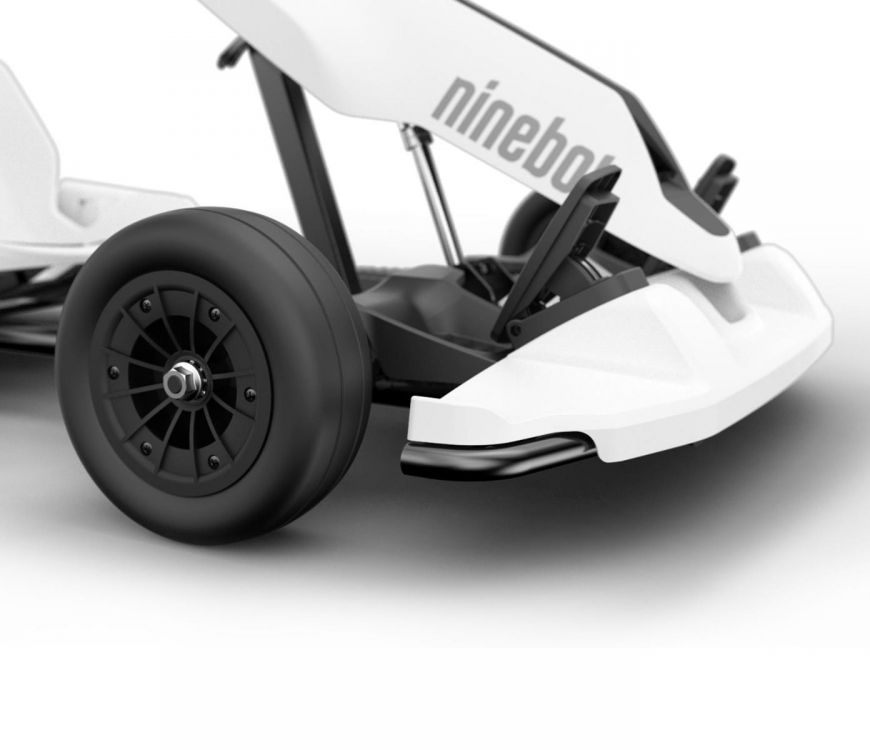 White Segway-Ninebot Gokart kit first generation with black Ninebot S self-balancing device. Close-up on front solid tire for drifting, front bumper, and gas pedal (24km/h top speed)